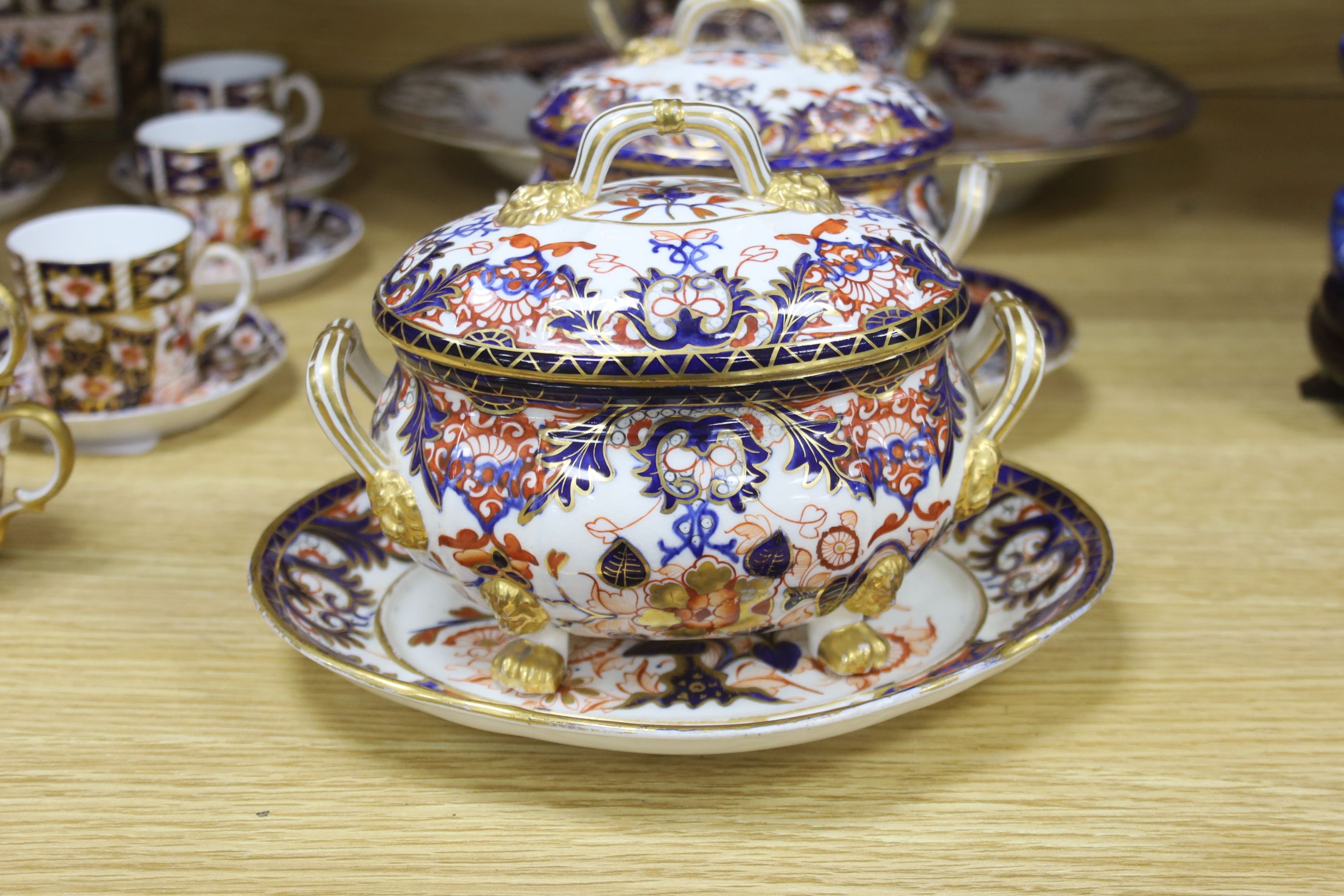 A collection of Royal Crown Derby Imari patterned ceramics including cups, side plates and platter